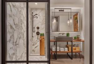 a bathroom with a shower and a sink at 1 Hotel Central Park in New York +45 photos