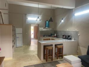 a kitchen with a island in a room at Takasira Appartment Downtown 2 in Fort Dauphin