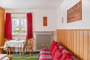 a living room with a couch and a table at Ferienwohnung 1 in Wallgau