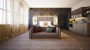 a bedroom with a bed and a couch in it at The Berkeley Richmond, Outset Collection by Hilton in Richmond