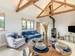 a living room with a table and a couch at 2 Bed in Bromyard oc-91816 in Collington