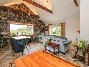 a living room with a couch and a table at The Stable in Dublin