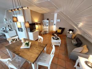 a living room with a couch and a table at Ferienwohnungen Naheliebe in Bärenbach