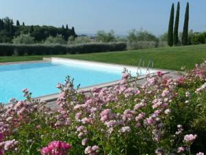 a pool of water with flowers in it at Sangallo Park Hotel in Siena