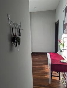 a dining room with a table and a red bench at Modern Downtown Loft Walk to Convention Center in Richmond