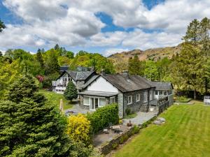 an exterior view of a house with a yard at Fells in Chapel Stile