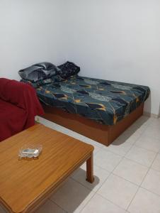 a room with a bed and a coffee table at Summer House 96 in Salamina