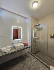 a bathroom with a sink and a shower at Riosol Laguna Azul in Sauce +40 photos