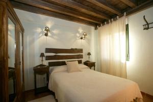 מיטה או מיטות בחדר ב-La Rinconera
