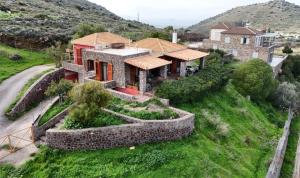 an aerial view of a house on a hill at Red House Retreat Aegina Kontos in Kondós