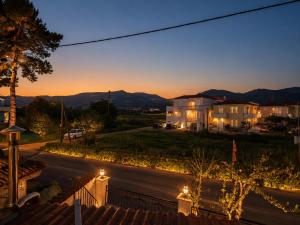 a view of a street at night with a house at Evanthia's House in Arianá