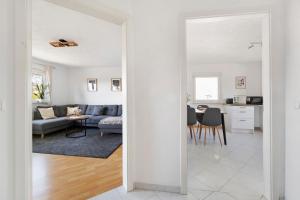 a living room and dining room with white walls at Four Seasons in Krautheim