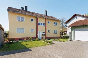 a house with a garage and a driveway at Four Seasons in Krautheim