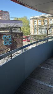 a view from a balcony of a building with a flower painted on it at Malijeed Services limited in London
