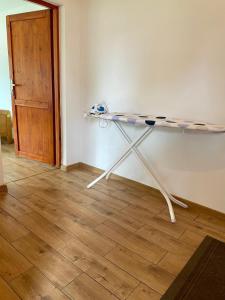 a table against a wall in a room at Przytulna Chata in Zamiany