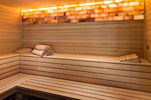 a sauna with two towels and two towels at Elba Premium Suites - Adults Only in Playa Blanca