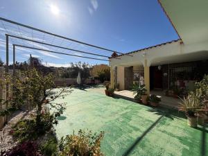 a house with a courtyard with potted plants at Chalet con Piscina Aguadulce in Aguadulce