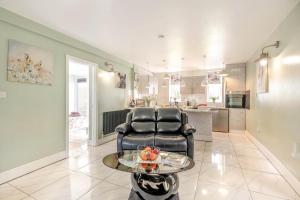 a living room with a chair and a table at 1 Bed in Beccles oc-65080 in Beccles +17 photos