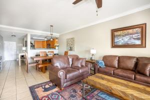 a living room with a couch and a chair at Mountain View Condo 1306 in Pigeon Forge