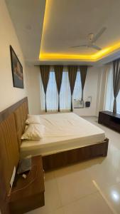 a large bed in a room with at Hotel elite in Palwal