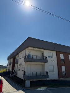a building with balconies on the side of it at M2 Apartments in Štip