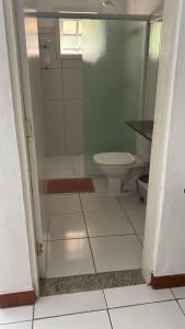 a bathroom with a shower and a toilet at Casa Brasil pousada e lazer in Trindade +28 photos