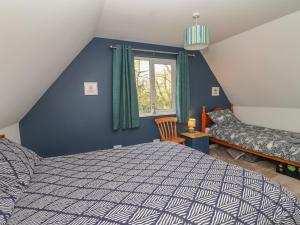 a bedroom with a bed and a window at Mayfly Lodge in Bodmin +27 photos
