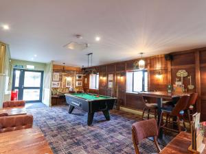 a living room with a pool table in it at Mayfly Lodge in Bodmin