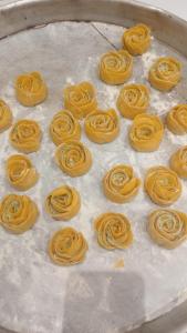 a tray of uncooked yellow pastaerekpectspectssenalsenalsenalsenalsenalsenal at Shtepia e Bardhe in Grykë-Orosh +45 photos
