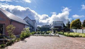 a brick driveway in front of a building at Panorama Villa in Graskop