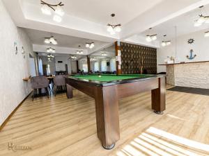 a billiard room with a pool table in it at RAMZES USTKA -pokoje z balkonami, parking gratis ,rowery ,dobry dojazd do plazy i centrum in Ustka