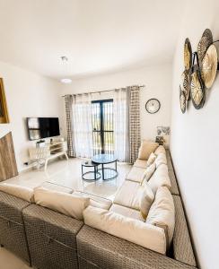 a living room with a couch and a table at Sea La Vie Villa in Grande Gaube
