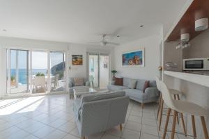 a living room with a couch and a table at Maryvilla Inspiración y Vacaciones - Villa Mascarat in Calpe