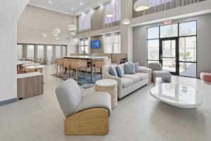 a living room with couches and a dining room at Hampton Inn & Suites Pharr in Pharr