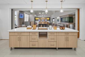 a kitchen with a large island with white counter top at Hampton Inn & Suites Pharr in Pharr