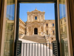 a view of a building from a window at Immacolata Rooms in Noto