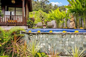 a house with a swimming pool in a garden at Escape To Paradise With Private Pool in Silebeng