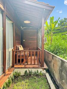 a porch of a house with a balcony at Escape To Paradise With Private Pool in Silebeng