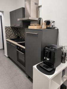 a kitchen with a coffee maker on a counter at GuestNest-Erfurt in Erfurt