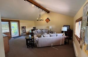 a living room with a couch and a table at Lighthouse Pointe Resort in Point Arena