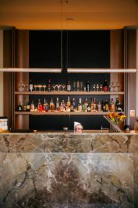 a bar with a lot of bottles of alcohol at Sol Boutique Hotel in Vlorë +91 photos