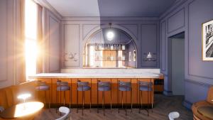 a bar in a room with a table and chairs at Hotel Orlo in Greensboro