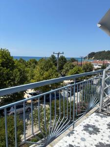 a balcony with a view of the ocean at Victoria's Blue studios in Siviri