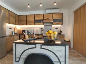 a kitchen with a bowl of fruit on a counter at Sunrise House in Kefalos