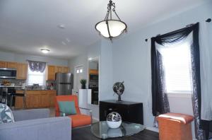 a living room with a couch and a table at West New York room 14 in West New York +11 photos