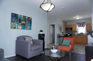 a living room with two chairs and a table at West New York room 14 in West New York