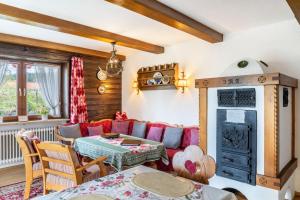 a living room with a couch and a table at Ferienwohnung Parterre in Wallgau