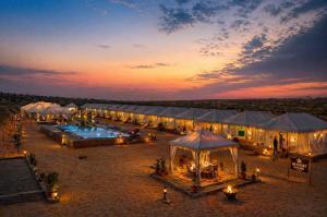 an overhead view of a group of tents with lights at Sky Desert Safari With Swimming Pool in Jaisalmer