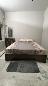 a bedroom with a bed in a room at Cozy Cove 3BHK in Cuttack