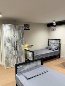 a room with two beds in a room at The Loft Hostel in Tashkent +40 photos
